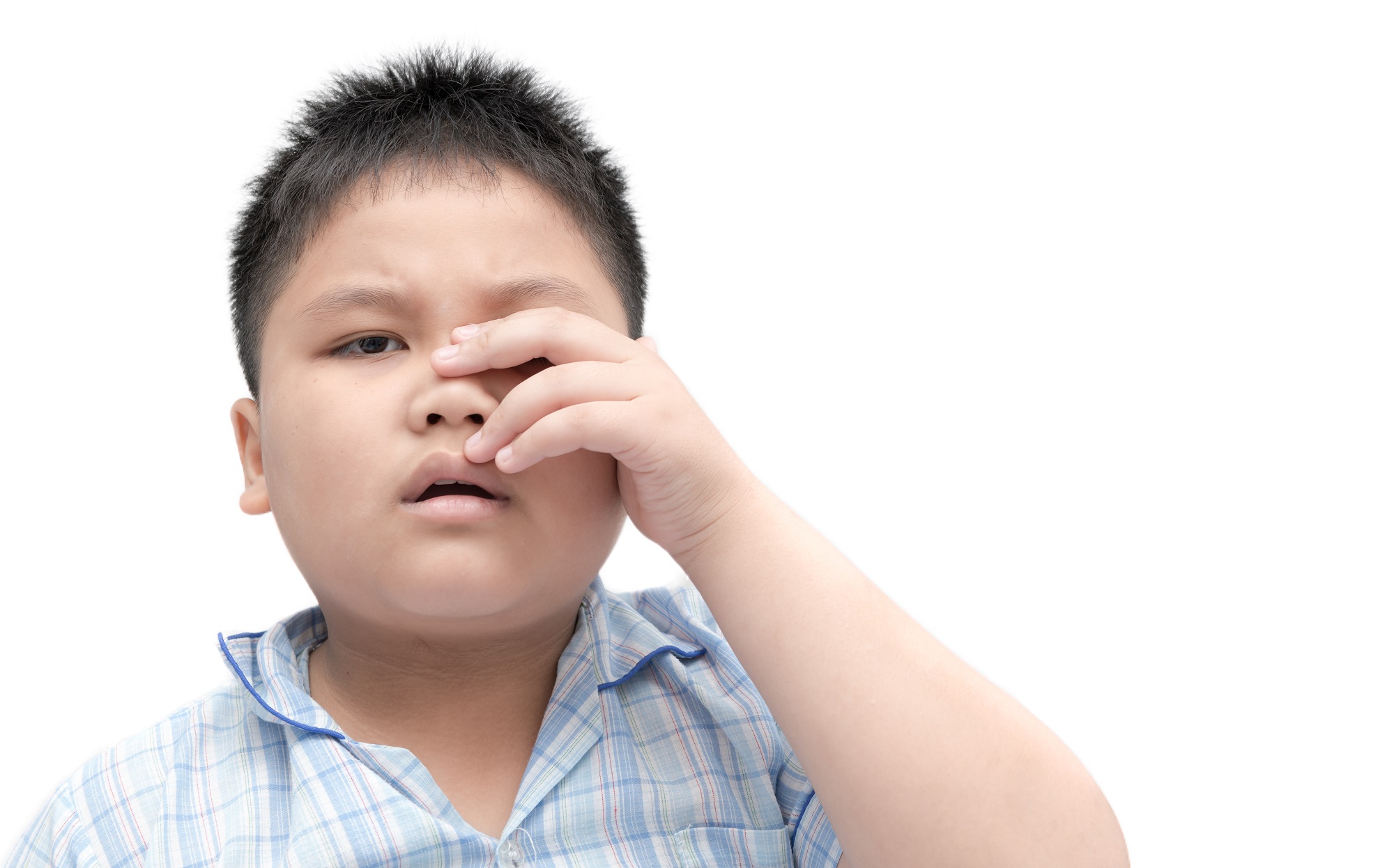 boy rubbing his eyes