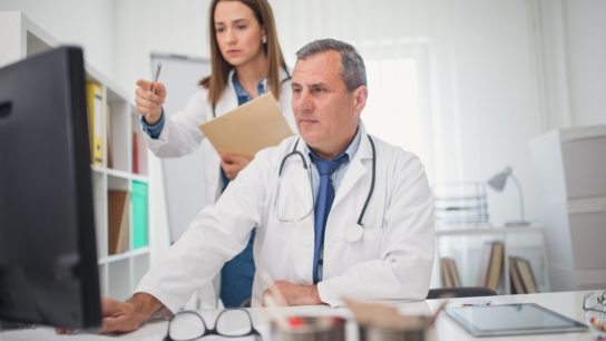 Clinicians registering on computer