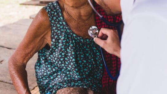 Male-Doctor-listening- heart-beat-and-breathing-of-Elderly-Woman