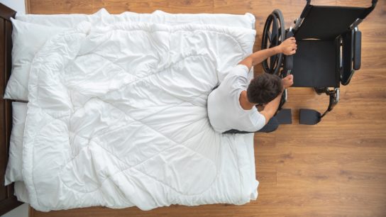 patient getting into wheelchair
