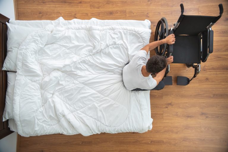 patient getting into wheelchair