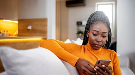 woman-looking-at-phone-for-mental-health-app