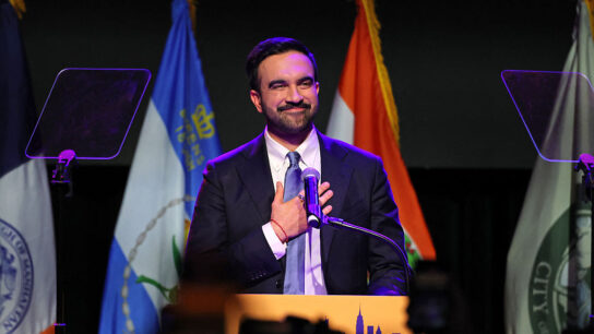 New York City Mayoral candidate Zohran Mamdani stands at podium during an election night event at the Brooklyn Paramount Theater.